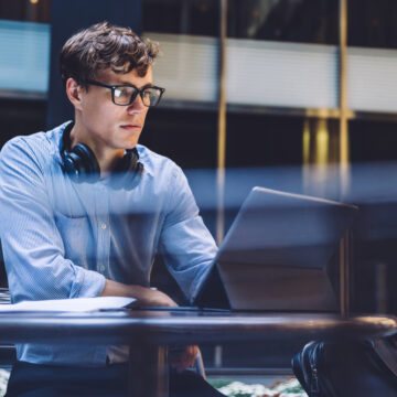 Young Office Worker Using Laptop