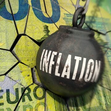 3D Illustration Of Wrecking Ball With The Word Inflation Crashing Into A Map Of The Eurozone