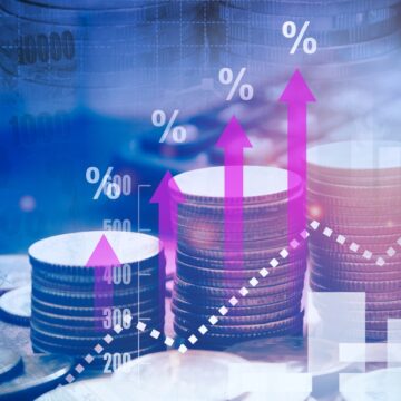 Financial Interest Rate Hikes Represented By Graph Of Growing Stacks Of Coins