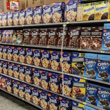 Sugary Cereal Boxes Lined Up On Grocery Store Shelves