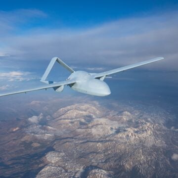 Unmanned Military Drone UAV Flying In The Air ON Reconnaissance Flight