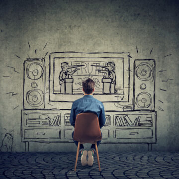 Fake News Concept Of A Man Watching Television With Two Debating Politicians