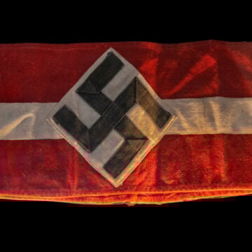 Arm Band With Nazi Symbol And Red And White Background