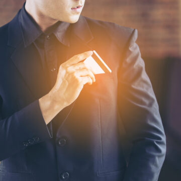 Man In Black Suit Taking Out Credit Card