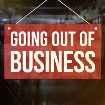 Going Out Of Business Sign In Front Of A Restaurant
