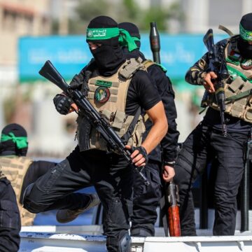 Masked Members Of The Al-qassam Brigades, The Military Wing Of The Palestinian Organization Hamas