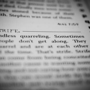 Closeup Of The Word Strife As Defined In The Dictionary