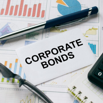 Business Card With The Text Corporate Bonds And Eyeglasses, Pen, And Graphs