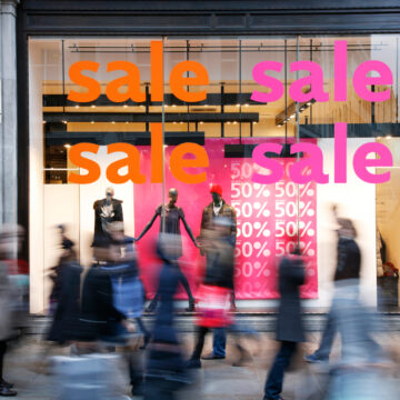 Sale Signs In Shop Window At London Shopping Street