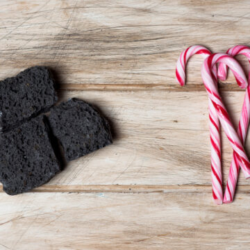 Above Angle View Of Some Pieces Of Candy And Coal