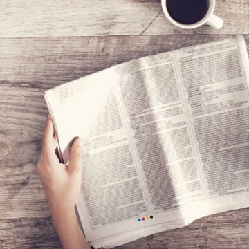 Person Reading A Newspaper