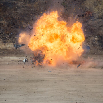 Car Parts Blown Apart From Explosion