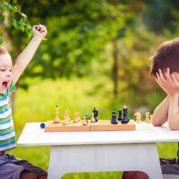 Ecstatic Boy After Winning A Game Of Chess