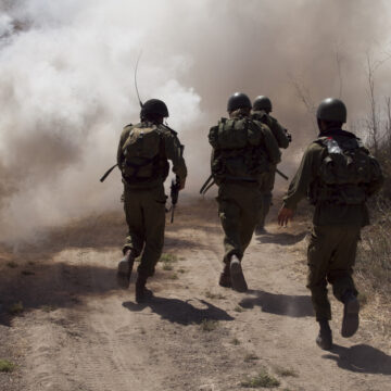 Soldiers Running Through Thick Smoke
