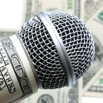 Microphone And Money Representing Financial Influence Of Media