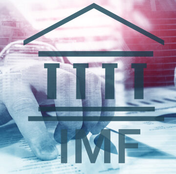 Collage of Hands And Economic Spreadsheets With IMF Letters In Foreground