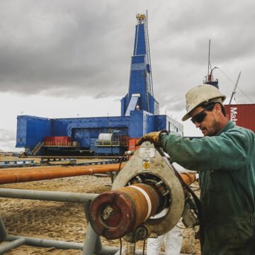 Sakhalin,,Russia,-,July,30,,2013:,A,Worker,Checks,The A Worker Checks A Pipeline In Sakhalin, Russia