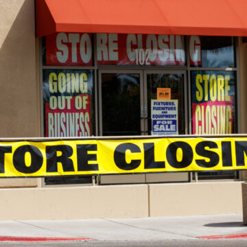 Store Closing And Going Out Of Business Signs Displayed At Store
