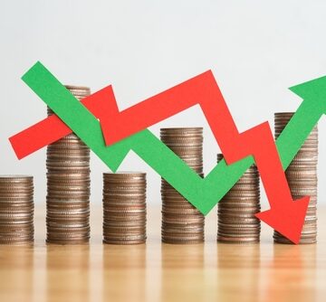 Stack,Coins,And,Arrow,Red,Green,Graph,Chart,Volatility,Up Stack Of Coins And Red And Green Arrows Showing Graph/Chart Volatility