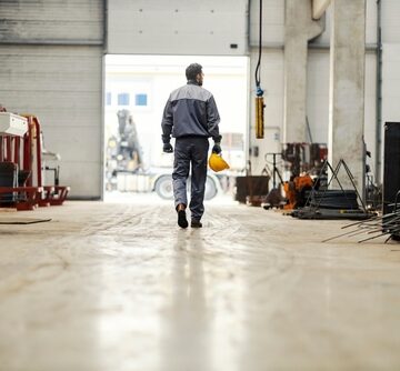 A Metallurgy Worker Leaves Work And Heads Towards Exit