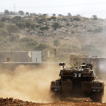 A Military Tank Approaches Occupied Land In The West Bank
