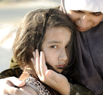 A Sad Palestinian Girl And Her Mother