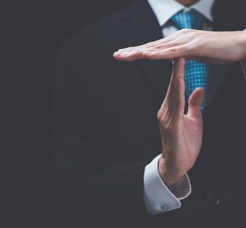 Businessman's Hands Signaling A Time Out