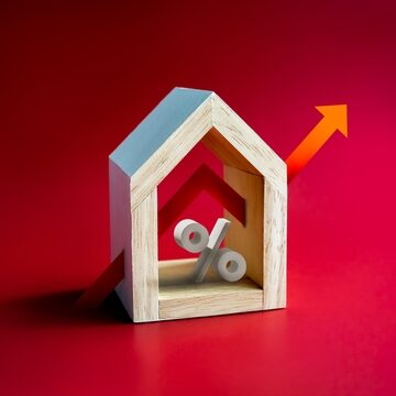 Concept Image Of Home With Percentage Symbol And Red Up Arrow