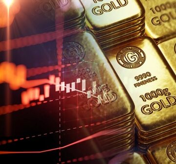 Stacks Of Shiny Gold Bars And Graph On Down Trend