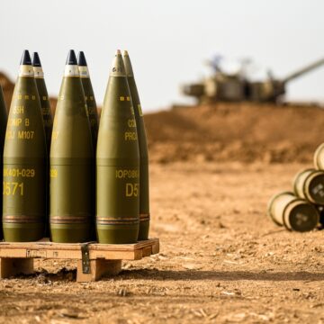Artillery Shells With Tank In The Background
