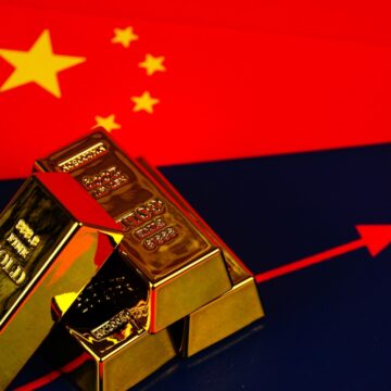 Concept Image Of the Flag Of China Topped With Bars Of Gold And An Up Arrow