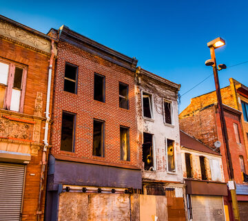 Evening Light On Abandoned Buildings In Old Town Mall, Baltimore, MD, USA