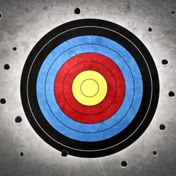 Bullseye Target With Holes All Around And None Making The Target