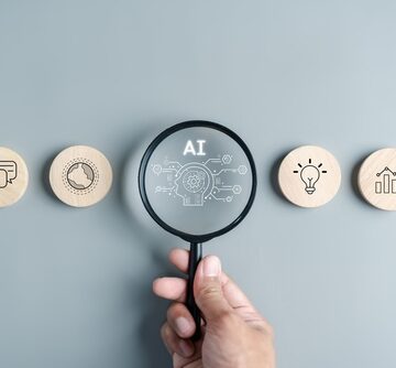 Concept Image Of AI Technology With Magnifying Glass Looking At Symbols