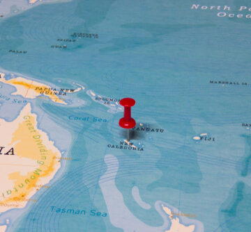 A Red Pin On New Caledonia Off The Coast Of Australia On The World Map