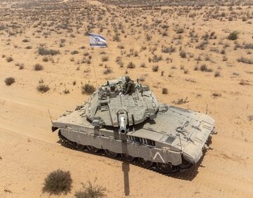 An Israeli Tank Doing Maneuvers In An Open Field