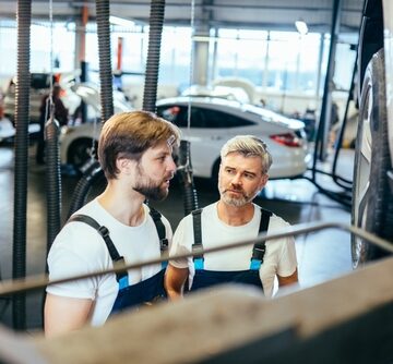 Automotive Technicians Repairing Autos