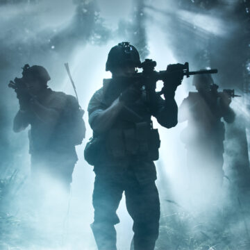 Paramilitary Soldiers In Foggy Forest