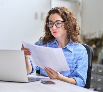 Young, Busy, Business Woman Reviewing Business Information