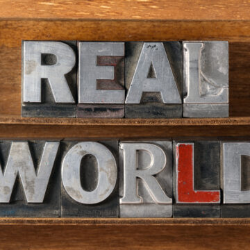 Real,World,Phrase,Made,From,Metallic,Letterpress,Type,On,Wooden SYNTHETIC DEVOLUTION: HOW TO DO AWAY WITH “UNFORTUNATE” REALISM IN AI