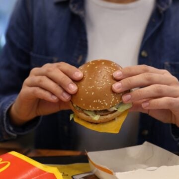 A Woman With McDonald's Burger In Lviv, Ukraine