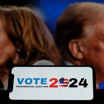 Concept Image With Photos Of Vice President Kamala Harris And Donald Trump With Vote 2024 Sign