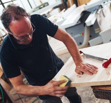 Gen-X-aged Man Working As A Carpenter In A Workshop