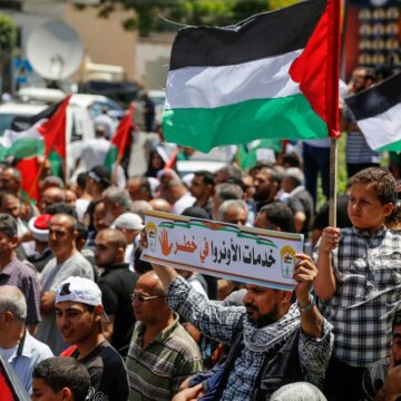 Palestinian Refugees Gather With National Flags Outside The United Nations