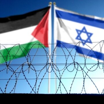 Palestinian And Israeli Flags Behind A Barbed Wire Fence