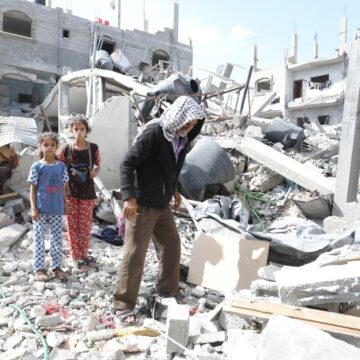 Palestinian Father And Children Inspect The Ruins Of Their Home After It Was Destroyed By An Airstrike