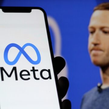 In,This,Photo,The,Meta,Logo,With,Ceo,Mark,Zuckerberg Facebook CEO Mark Zuckerberg With Meta Logo On Mobile Phone Display In Foreground
