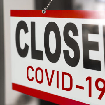 Closed Covid-19 Sign On Door Of Business