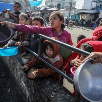 Displaced Palestinian Children Waiting For Food Distribution From A Charity Organization