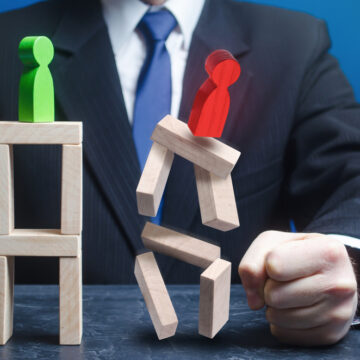 Businessman Defeats His Opponent In Jenga As Wooden Pieces Come Crashing Down